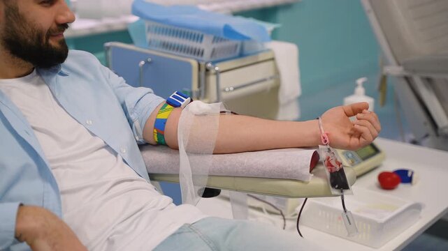 Male patient donating blood in a hospital transfusion center