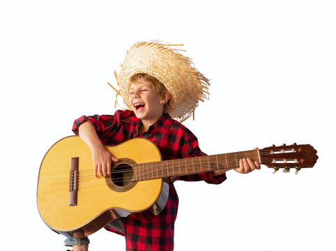 Caucasian child dressed for the June fiestas in Brazil, isolated on a light background