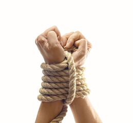 Tied female hands trying to break rope. Freedom, escape, resistance and overcoming limitations.