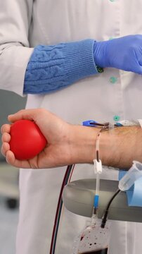 Male patient donating blood in a hospital clinic