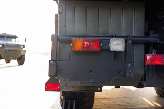 Military equipment and army equipment.. Captured image highlighting back of military truck with environment details. Thorough examination displaying rear section of army transport vehicle