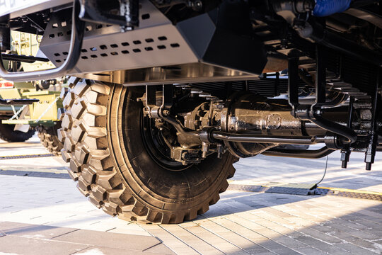 Military equipment and army equipment.. Close examination of heavy vehicle mechanical systems. Comprehensive detailed view highlighting intricate mechanical features of military vehicle