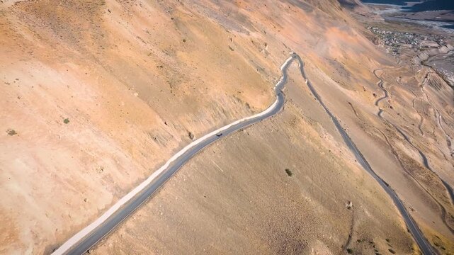 SUV, 4x4, off-road, dirt road, driving, vehicle, car, tracking shot, road trip, adventure, freedom, isolation, solo travel, epic, cinematic, scale, vast, barren, cold desert, Himalayas, Spiti Valley, 