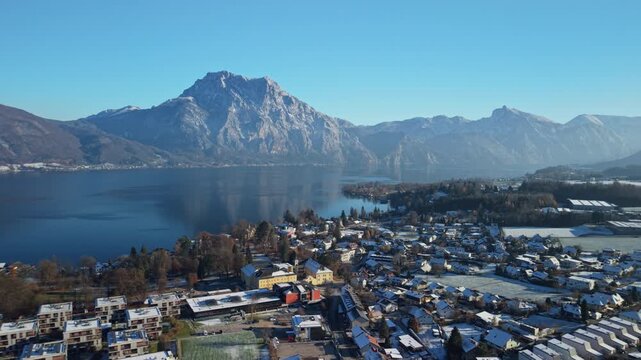 Aerial view of snowy Altm&uuml;nster village and Traunstein mountain in winter, Austria