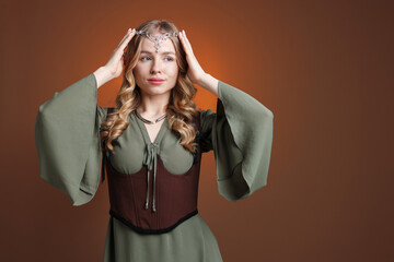 Naklejka premium Beautiful elf girl on brown gradient background