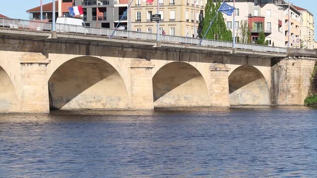 Stone bridge of roanne over loire river on a sunny day
