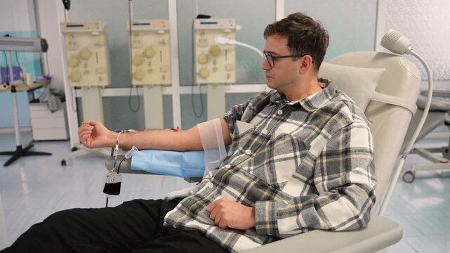 Male volunteer donating rare blood at a donation center