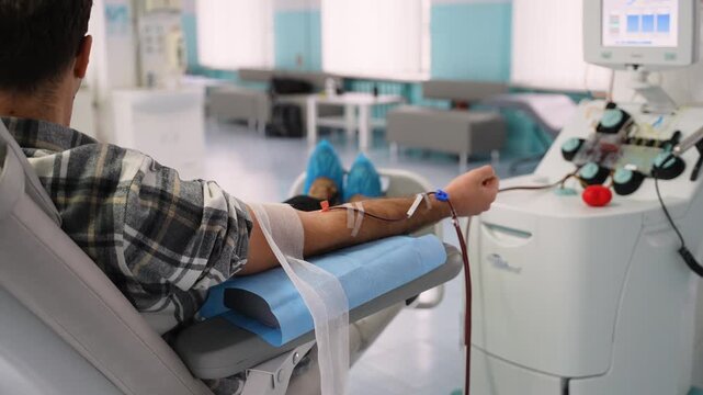 Male volunteer donating rare blood at a hospital donation center
