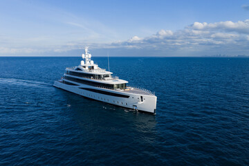 Obraz premium Yacht boat tour. Luxury boat yachting. Motorboat sailing at sea. Luxury private yacht in sea. Motor yacht luxury vessel. Boat motor aerial. Vacation on summer. Aerial view motorboat