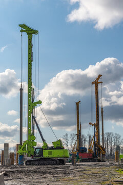 Canada, BC, Vancouver.  Pile driving equipment preparing foundations for residential construction on floodplain lands beside the Fraser River.