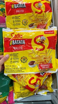 Salvador, Brazil - April 9, 2026: Packages of Sadia frozen french fries on a supermarket freezer shelf. Sadia batata palito. 