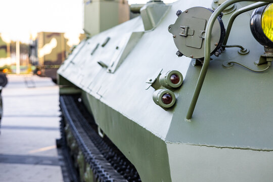 Military equipment and army equipment.. Tracked military carrier emphasizing strength and operational preparedness. Close examination of armored military transport highlighting robustness