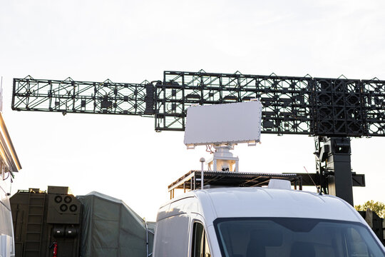 Military equipment and army equipment.. Deployable radar modules accompanied by support vehicles and shelters. Fieldready mobile radar systems equipped with support vehicles and protective