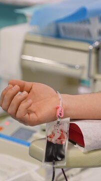 Male patient hand during blood donation process