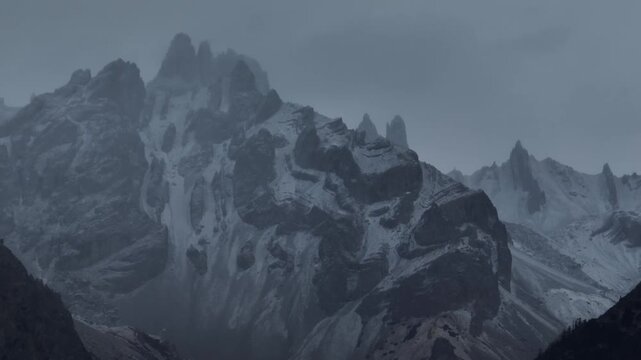 Aerial footage of beautiful high altitude snowcapped mountains landscape