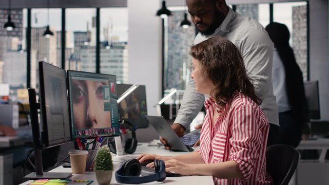 Editing photography on PC, diverse artistic team, creative retouching software, for color correction and image selection to create commercial materials. Advertising agency photo content.