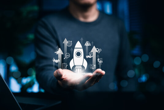 Business Growth Concept. Entrepreneur presents glowing rocket launch interface in hand symbolizing startup strategy, innovation, analytics, teamwork, scalable digital business success, fast growth,