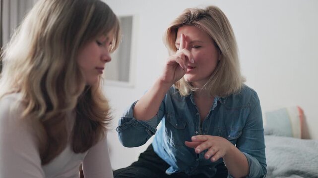 Mother having a serious conversation with her teenage daughter