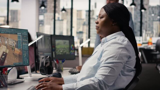 Black designer using architectural software and virtual assets for floor plan and 3D render on computer. Interior developer designing new apartment layout in remodeling program.