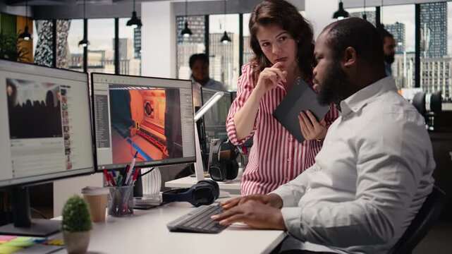 Team using programming software and commands to build fantasy video game, designing spaceship models and creating gaming assets. Immersive virtual world in creative agency office.