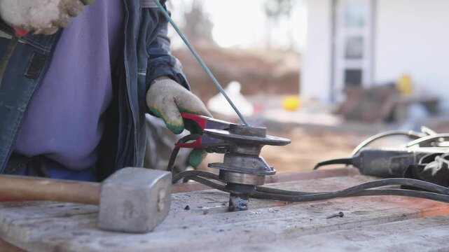 Metalwork Craftsman Forging. Artisan Manipulating Metal Parts With Hammer And Pliers. Detailed Workshop Scene Of Craftsman Carefully Shaping And Securing Metal Components With Tools