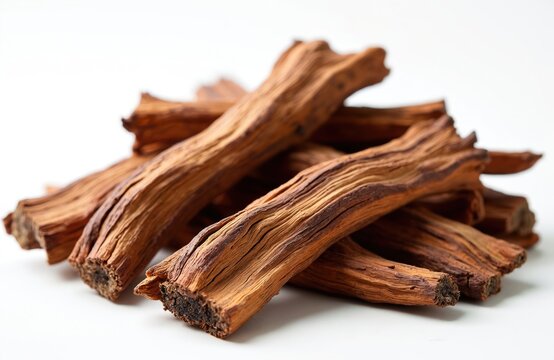 Dried catuaba bark sticks pile on white surface. Natural herbal remedy from Brazil used for teas and traditional medicine. Aphrodisiac and stimulant properties known.