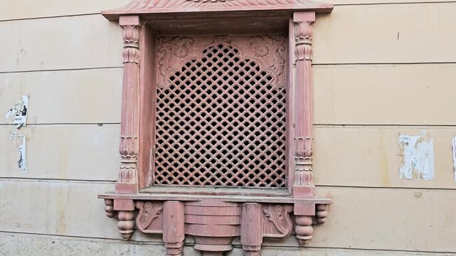 Traditional Indian Carved Stone Jali Window with Ornamental Pillars, Heritage Architectural Lattice Design, Historic Building Facade