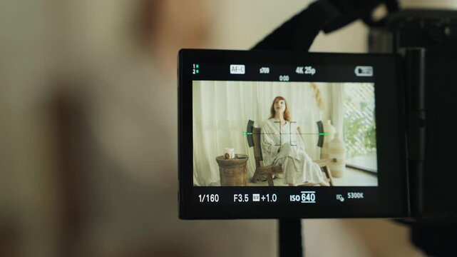 Influencer filming beauty content for vlog on mirrorless camera