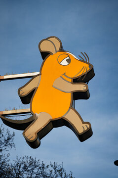 Cologne, Germany April 08 2026: Large 3D sign of the famous orange mouse character from the German TV show "Die Sendung mit der Maus" at the WDR broadcasting building in Cologne.