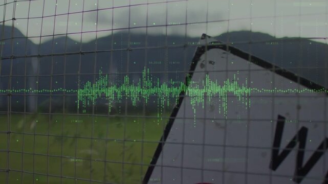 Revealing tilted metal road sign leaning behind fence at roadside with green waveform, copy space