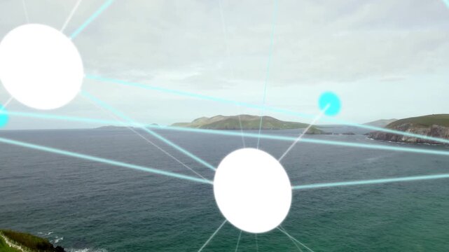 Bright white circular graphic node glowing and radiating cyan beams over grassy cliff and sea