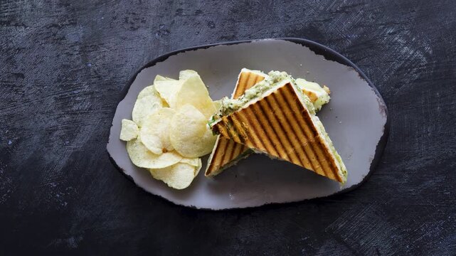 Serving a Grilled Chicken Panini with Potato Chips