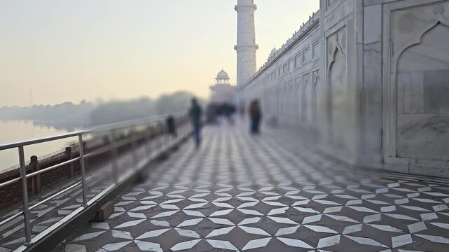 Scenic view of the Yamuna River in Agra from Taj Mahal, India. The iconic Mughal monument is seen alongside calm river waters and surrounding landscape, capturing heritage, architecture.