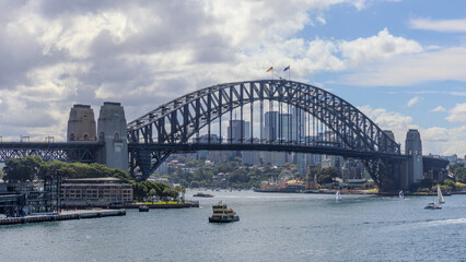Obraz premium View of Sydney Harbour and Circular Quay and Sydney Harbour Bridge in on beautiful Autumn Afternoon beautiful colours in the Sky Sydney NSW Australia