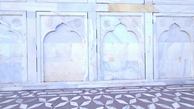 Intricate marble wall carvings and jali work at Taj Mahal, Mughal architecture with geometric patterns, arches, heritage monument showcasing Islamic art, craftsmanship and cultural tourism Agra India