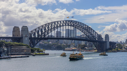 Fototapeta premium Title: View of Sydney Harbour and Circular Quay and Sydney Harbour Bridge in on beautiful Autumn Afternoon beautiful Sky Sydney NSW Australia