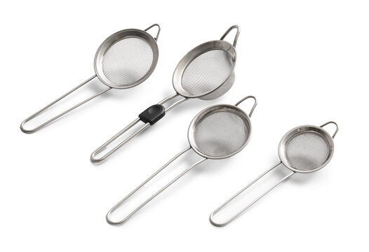 Different metal sieves on light background