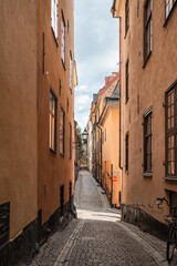 Fototapeta premium Gamla Stan old city in Stockholm, Sweden views of orange and yellow homes.