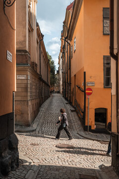 Gamla Stan, Stockholm old city in Sweden. Historic yellow and orange homes.