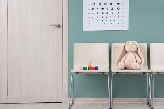 Toy bunny with cubes on chairs in pediatrician's hall