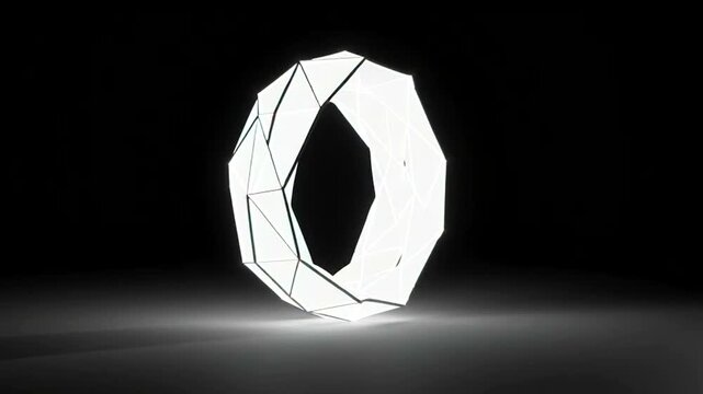 Geometric Paper Sculpture Rotating in Spotlight.
