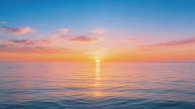 sunset over calm sea glowing horizon orange sky