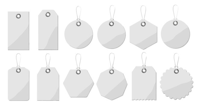 Blank white paper price tags set with hanging strings and silver eyelets for retail sale and product labeling