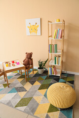 Naklejka premium Interior of children's room with bookshelf, table and toys