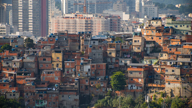 Urban social contrast in Sao Paulo with Paraisopolis favelas against modern skyline with copy space