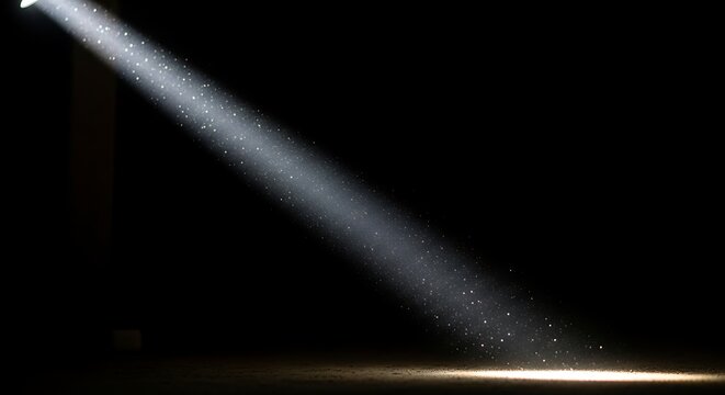 Light beam shining through dark space.