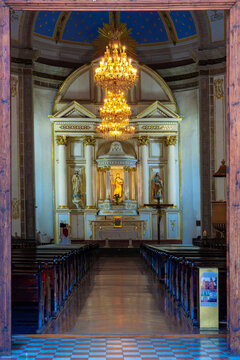 nterior nave and golden neoclassical altar of Parish San Juan Bautista with crystal chandelier and blue painted dome, Metepec, State of Mexico, Mexico