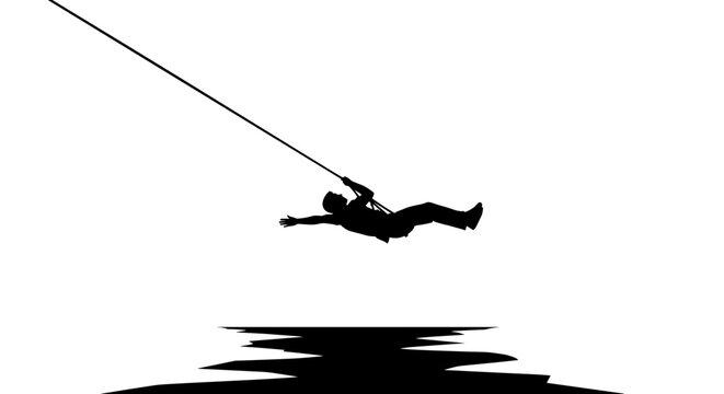 Man ziplining over water silhouette.