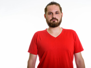 Obraz premium Bearded Young Man in Red V-Neck T-Shirt - Casual Male Studio Portrait