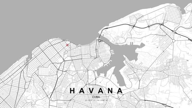 A grayscale street map of Havana, Cuba shows a dense urban road network with a red location pin marking a specific point within the city layout.